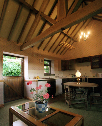 The dining area and kitchen in the Mill Barn