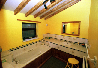 The beamed bathroom in the Mill Barn.